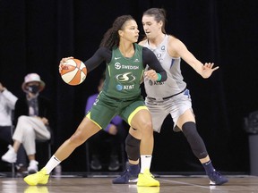 Chatham's Bridget Carleton, right, of the Minnesota Lynx defends Alysha Clark of the Seattle Storm during Game 2 of their WNBA semifinal in September 2020. Carleton says she's focused this season on being a lockdown defender. Ned Dishman/NBAE/Getty Images ORG XMIT: 775567667