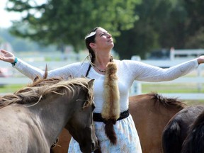 Andria Dyer, of Chippewa of the Thames First Nation, has used Ojibwe spirit horses for therapy at TJ Stables in Chatham. The horse facility has launched a new program to teach visitors about Indigenous culture and history through the horses. Submitted