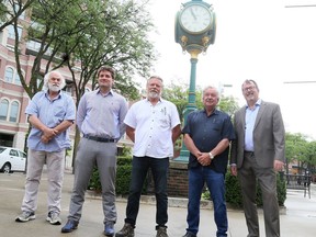 New Downtown Chatham Centre co-owners Rob Myers (left), Pete Tsirimbis, Ron Nydam and Don Tetrault are joined by Chatham-Kent Mayor Darrin Canniff on June 25. Mark Malone/Postmedia Network