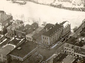 Augustine McDonell had his offices in the Eberts Block, which is the large building at centre, just to the left of Fifth Street Bridge. The photo was taken in 1929.