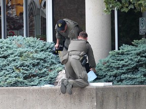 Members of the OPP explosive disposal unit prepare to recover a suspicious package. The unit was called in after Chatham-Kent police responded to a report of a suspicious package outside of the Judy LaMarsh Building in Chatham on Monday morning. Ellwood Shreve Photo/Chatham Daily News