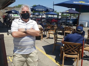 With the reopening of patios on Friday, Mike Buckler, co-owner of Mike's Place in Chatham, said he's looking forward to a great summer. He's shown in the patio area that was expanded last year. (Trevor Terfloth/The Daily News)