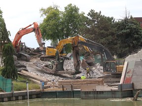 These heavy machine operators were displaying some impressive teamwork as they tackled the job of removing this large section of steel during the demolition of the Third Street Bridge in Chatham on in this file photo from June 2021. The downtown span is was torn down as part of a $14 million rehabilitation project. (Ellwood Shreve/Chatham Daily News)