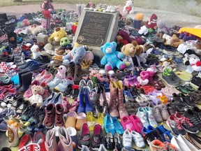 More than 200 pairs of shoes were placed inside the tepee that sits along the shores of Cold Lake to honour and remember the children found in a mass grave near a Kamloops residential school. PHOTO BY TANYA BOUDREAU