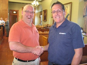 Bill Makinson (right), named the 2016 community campaign fundraising chair for United Way/Centraide SDG, accepts congratulations from 2015 campaign chair Michael Galvin. Photo on June 21, 2016, in Cornwall, Ont. Todd Hambleton/Cornwall Standard-Freeholder/Postmedia Network