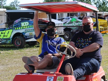 The speedway's Martin Belanger (left) and Raymond Lavergne, enjoying the calm before the storm of frenetic activity on a race day. Photo on Sunday, June 20, 2021, in Cornwall, Ont. Todd Hambleton/Cornwall Standard-Freeholder/Postmedia Network