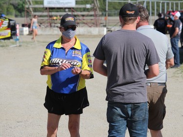 Pit gate attendant Jean Patenaude checking for wristbands and face coverings on Sunday afternoon. Photo on Sunday, June 20, 2021, in Cornwall, Ont. Todd Hambleton/Cornwall Standard-Freeholder/Postmedia Network