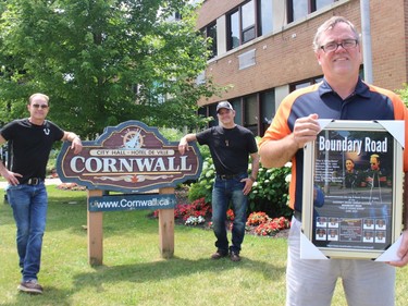 John McIntosh (left) and Pete Nichol presented a Boundary Road plaque to the city, to acting mayor Todd Bennett. Photo on Sunday, June 27, 2021, in Cornwall, Ont. Todd Hambleton/Cornwall Standard-Freeholder/Postmedia Network