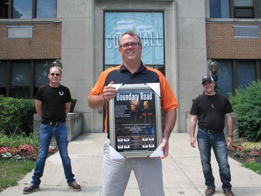 John McIntosh (left) and Pete Nichol presented a Boundary Road plaque to the city, to acting mayor Todd Bennett. Photo on Sunday, June 27, 2021, in Cornwall, Ont. Todd Hambleton/Cornwall Standard-Freeholder/Postmedia Network