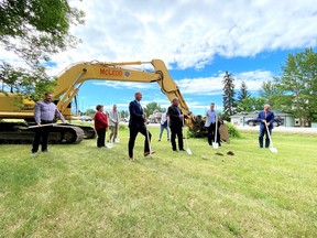 Local officials plus provincial transportation minister Ric McIver, local MLA Peter Guthrie and Rocky View County reeve Daniel Henn at a June 25 sod turning ceremony for improvements to the Highway 1A corridor.