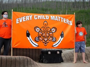 A sign saying every child matters is held up in memory of the 215 children whose bodies were found at a Kamloops residential school. Laura Beamish/Postmedia Network