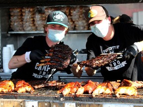 Two ribbers at Wood Buffalo Ribfest on Friday, June 25, 2021 in the Casman Centre parking lot. Laura Beamish/Fort McMurray Today/Postmedia Network