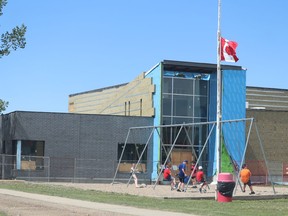 The new Delia school is trucking along. Students enjoyed a break from classes on June 2 while workers toiled away on the exterior of the building. Jackie Irwin/Postmedia