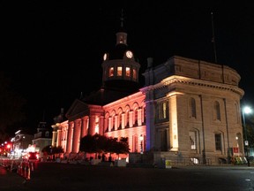 Kingston City Hall glows orange on Monday night, the first of nine nights of illumination in memory of 215 Indigenous children whose remains were discovered in unmarked graves on the site of a former residential school in Kamloops, B.C.