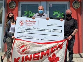 Graham Forsythe, chair of the Kinsmen Dream Home, presents a $50,000 donation to Harold Parsons, executive director, and Amanda Guarino, supervisor of community engagement, at BGC Kingston as part of the BGC Kingston Whig-Standard 2021 Campaign. BGC Kingston photo