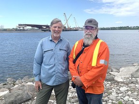 Mike Hill and Paul Wash are taking photographs and creating videos using drone footage about the building of Kingston's newest bridge. (Peter Hendra/The Kingston Whig-Standard/Postmedia Network)