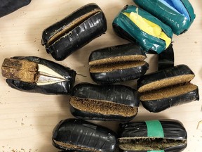 Tobacco and marijuana seized by the Kingston Police street crime unit from a man and woman spotted dropping contraband into Collins Bay Institution on June 11.