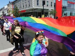 More than 900 people walked down crowd-lined Princess Street sporting rainbow clothes, facepaint, flags and more during the Kingston Pride Parade on Saturday, June 15, 2019.