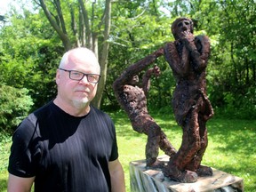 Artist Pat Shea in his Kingston backyard with his maquette sculpture on Thursday June 10, 2021.