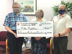 Photo supplied
Mike and Sam Maslakow accept their prize in the St. Joseph’s Foundation 50/50 draw for May from William Elliott, the foundation chair.