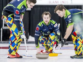 Skip Rylan Kleiter, centre, watches his rock as teammates Joshua Mattern, left, and Matthieu Taillon prepare to sweep during a match against Team Bernath at the Saskatchewan provincial junior curling championships at Sutherland Curling Club in Saskatoon on Monday, Dec. 30, 2019. PHOTO BY MATT SMITH /Saskatoon StarPhoenix