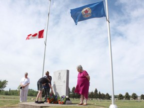 Grade 8 students from LP Miller School in Nipawin placed flags on the graves of veterans at Mabel Hill Cemetery on June 4 as part of Decoration Day observances. The day is to remember the service of military personnel in a similar manner to Remembrance Day, which honours those who died while in service. Photo Susan McNeil.