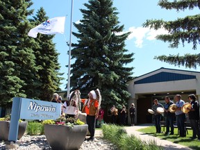 Drummers sang while the Reconciliation Flag was raised at Nipawin Town Hall on June 21, National Indigenous People's Day. Helping to raise the flag are Mayor Rennie Harper, Grand Chief Brian Hardlotte of the PAGC, Chief Marcel Head of Shoal Lake and Brent Digness, representing the Metis Nation of Saskatchewan. Photo Susan McNeil.