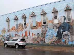 The Marguerite d'Youville and Her Mission mural located in downtown Pembroke, at the corner of Pembroke Street West and Church Street. It was painted by mural artist Pierre Hardy in 1992.