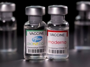 Vials with Pfizer-BioNTech and Moderna coronavirus disease (COVID-19) vaccine labels. DADO RUVIC