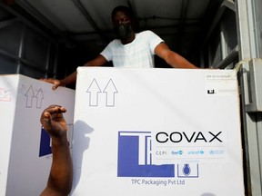 FILE PHOTO: Boxes of AstraZeneca/Oxford coronavirus vaccines, redeployed from the Democratic Republic of Congo, arrive at a cold storage facility in Accra, Ghana, May 7, 2021. REUTERS/Francis Kokoroko/File Photo