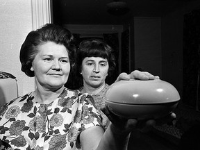 Margaret Erdely of RR 3 Glencoe uses a pair of fruit bowls to show what the UFO looked like the night that she and her sister-in-law Violet Coad (right) were driving their daughters home from a 4-H Club meeting in October 1967. Courtesy of London Free Press Collection of Photographic Negatives, Western Archives, Western University, Oct. 26, 1967.