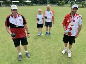 The Woodstock Lawn Bowling Club has been successful in tournaments the last few years, but it's trying to increase membership. Pictured from left: Member Derek McKie, president Lorraine McLean, treasurer Carl McLean, and member Jurgen Fessler.