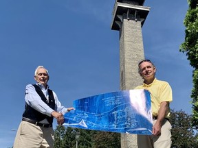Reg White, left, and Kevin Petrie, Friends of Stratford’s Shakespearean Gardens co-chairs, hold a sketch of the proposed restored layout of the historic green space off Huron Street.