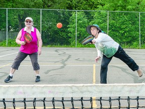 HAVING A PICKLEBALL: Heather makes a great return shot while her doubles partner Diane watches on. The doubles team partook in a friendly pickleball match with friends, at Snowden Park off Shannon Road. Sault Picleball club has grown to over 400 members now, and counting. BOB DAVIES/SAULT THIS WEEK
