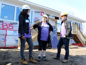 Katie Blunt, executive director of Habitat for Humanity Sault Ste. Marie & Area, Casey Gardner and board chair Dave Thompson speak at a build project in May 2019.