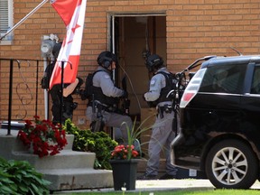 Sarnia police surround a Montrose Street home on Tuesday June 1, 2021 in Sarnia, Ont. Terry Bridge/Sarnia Observer/Postmedia Network