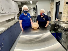 Kiwanis Club of Forest members Joan Rawlings, left, and Betty Fitchett stand in the new kitchen at the club's Kineto Theatre in Forest. The new kitchen in the basement of the historic downtown building has been completed but other renovations continue.