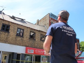 Mark Shephard, with Pollutech, flies a camera-equipped drone over a building on King Street in Forest that was heavily damaged in a fire that began Wednesday afternoon. Firefighters in Lambton Shores were still investigating the cause of the fire on Thursday.