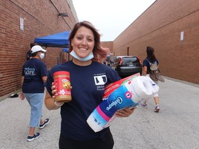 Kristen Lannan is shown Saturday during the second annual Anthony's H.O.P.E food drive at the Imperial Theatre for the Inn of the Good Shepherd.