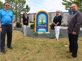 A sign recognizing the Rotary Club of Sarnia as a founding partner and supporter of Pathways Health Centre for Children has been installed on the centre's front lawn. From left, Mike Elliott, president of the Rotary Club of Sarnia, Pathways executive director Alison Morrison, Sandra Graham, with the Rotary Club of Sarnia Charitable Foundation, and Warren Kennedy, chairperson of the Pathway's board.