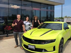 Aaron Ellenor is shown with his prize in a summer car raffle supporting Sarnia-Lambton Rebound. Shown with him are Kristin MacFarlane, of MacFarlane Chevrolet Buick GMC in Petrolia, and Anita Minielly of Rebound.