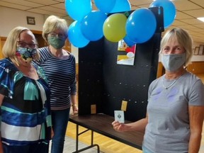 Bev Wood, right, of Simcoe won the $30,000 prize in the Rotary Club of Norfolk Sunrise's Catch the Ace lottery Friday at the Port Dover Legion. Gail Bouw, left, of the Rotary Club and Judy Buck of the Legion congratulated Wood.