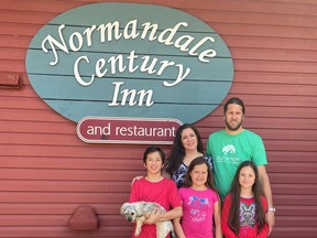 Maria Marquez and her husband Fernando Lacy with their children Emiliano, Maria and Frida outside the Normandale Century Inn and Restaurant. The couple purchased the Inn earlier this year.