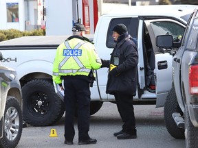 The Special Investigation Unit and Greater Sudbury Police investigate an incident at the Esso gas station on Regent Street on April 11, 2019. The SIU was called in after city police shot a suspect.