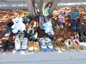 Children's shoes and stuffed toys have been placed at the site of a memorial at the N'Swakamok Native Friendship Centre in Sudbury, Ont. on Tuesday June 1, 2021, to commemorate the 215 children whose remains were found at a former residential school in Kamloops, BC. John Lappa/Sudbury Star/Postmedia Network