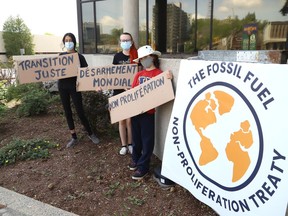 Fridays for Future Greater Sudbury climate activists Sophia Mathur, left, Jane Walker and Arik Kabaroff-Scott held a small rally outside city hall in Sudbury, Ont. on Friday June 4, 2021 during World Environment Day. The activists are urging the city to endorse the Fossil Fuel Non-Proliferation treaty. John Lappa/Sudbury Star/Postmedia Network