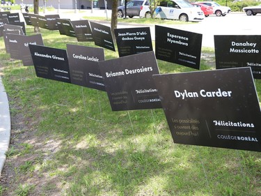 Signs featuring the names of graduating students are on display at College Boreal on Friday.
