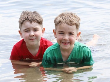 Killian Meechan, 4, left, and his brother, Malek, 6, cool off in Ramsey Lake on Tuesday. Environment Canada said Greater Sudbury can expect sunny skies on Wednesday with a high of 27 C.