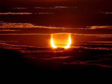 The 'ring of fire' eclipse is visible over Ramsey Lake on Thursday morning as the moon partially obscured the sun. Former Sudbury Star photographer Gino Donato used a Canon 6D Mark 2 camera and 70-200 lens, shooting at ISO 200 and f11. He made sure to look at the LCD screen rather than directly at the sun to protect his eyes.