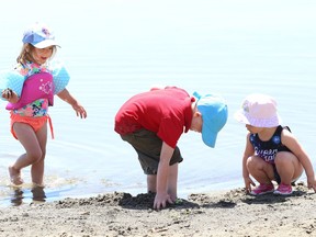 Adalayia Murray, 3, left, plays at the main beach at Bell Park with her brother, Parker, 5, and Stella Lingenfelter, 2, on June 15 last summer. Public Health Sudbury and Districts will be carrying out E.Coli sampling and safety assessments from June 14 to 25 this year to make sure all public beaches are suitable for use.